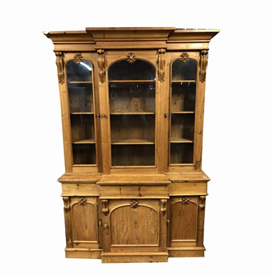 Lot 3020 - A pine breakfront bookcase, with three glazed...