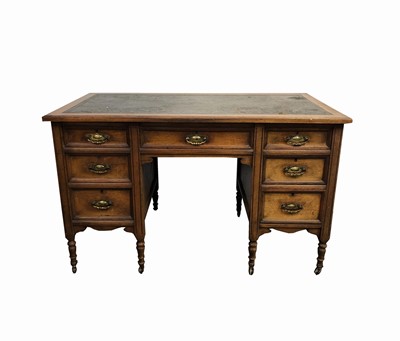 Lot 3023 - An Edwardian walnut pedestal desk, the...