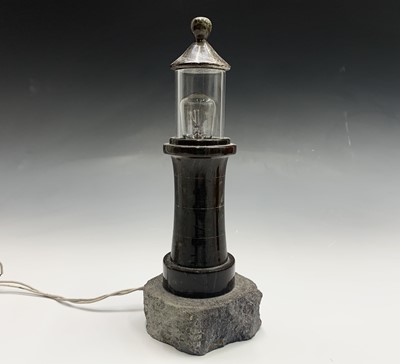 Lot 61 - A Cornish serpentine table lamp, modelled as a...