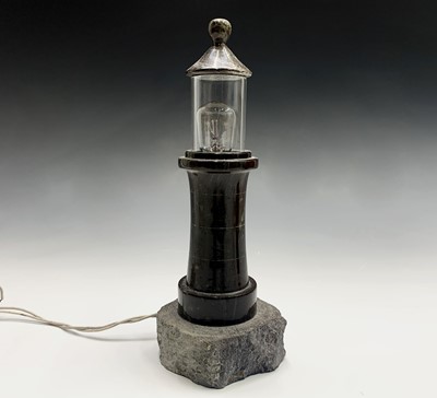 Lot 61 - A Cornish serpentine table lamp, modelled as a...