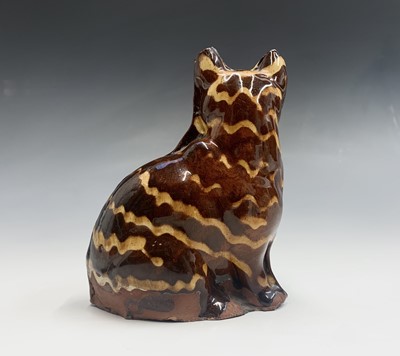 Lot 871 - A moulded redware slipware decorated model of...