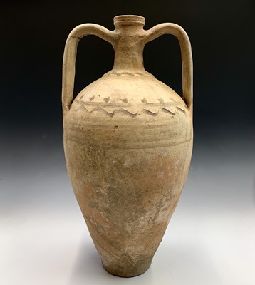 Lot 126 - A terracotta twin handled vessel with incised...