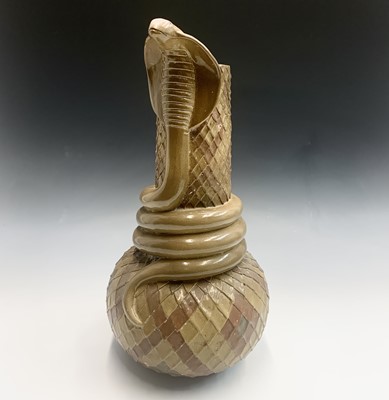 Lot 905 - A glazed terracotta vase, snake scale effect...