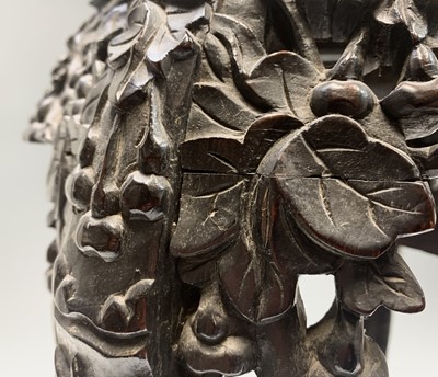 Lot 85 - A Chinese carved hardwood jardiniere stand,...