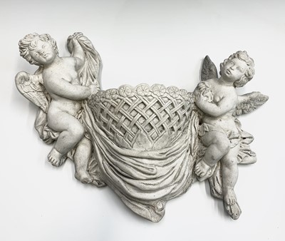 Lot 500 - A composite wall pocket modelled as cherubs...