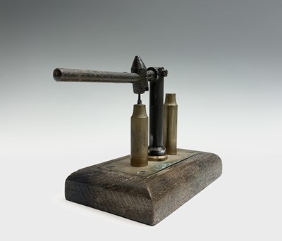 Lot 29 - A 20th century brass and steel bullet packer...