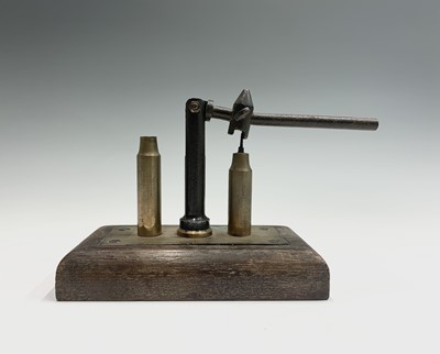 Lot 29 - A 20th century brass and steel bullet packer...
