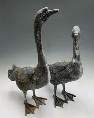 Lot 637 - A pair of metal geese garden ornaments. The...