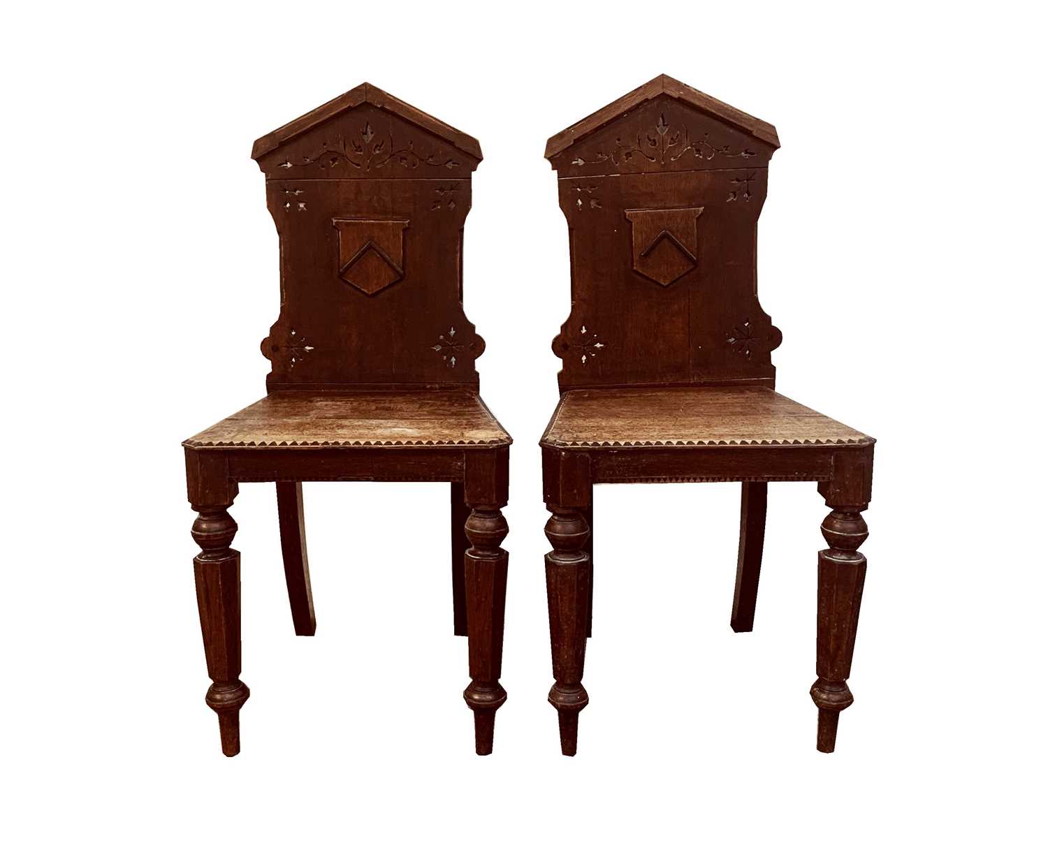 Lot 70 - A pair of oak hall chairs with Prideaux coat...