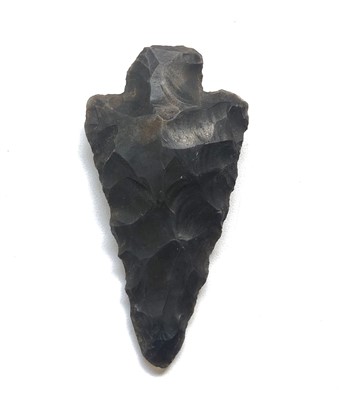 Lot 420 - Neolithic barbed and tanged spear/arrow head,...