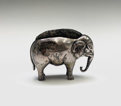 Lot 1079 - An Edwardian silver elephant pin cushion by...
