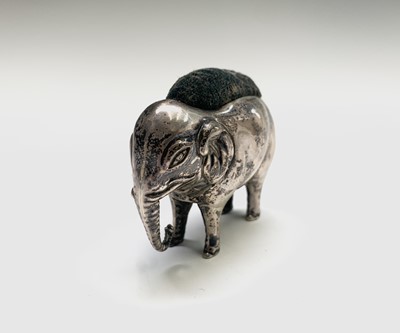 Lot 1079 - An Edwardian silver elephant pin cushion by...