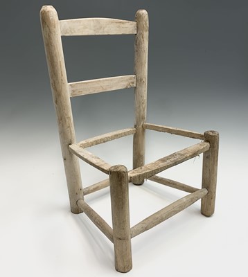 Lot 379 - A pine ladderback child's chair frame. Height...