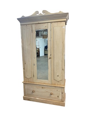 Lot 3052 - A pine wardrobe, with a single mirrored door...