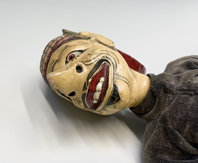 Lot 109 - Two Java painted wood puppets, length 71cm.