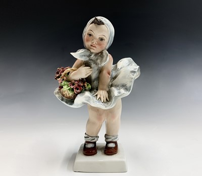 Lot 847 - An Italian pottery figure of a young girl, in...