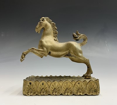 Lot 62 - A Regency gilt bronze figure of a rearing...