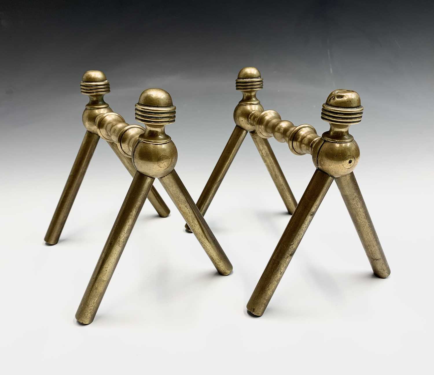 Lot 73 - A pair of Aesthetic Movement brass andirons,...
