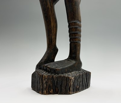 Lot 113 - An African carved hardwood tall tribal figure...