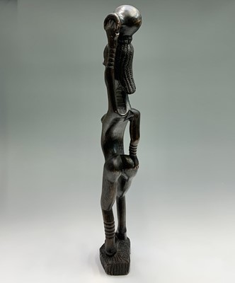 Lot 113 - An African carved hardwood tall tribal figure...