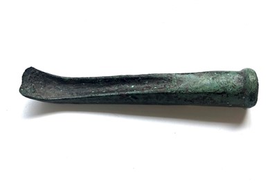 Lot 475 - Bronze Age curved and socketted chisel bronze...