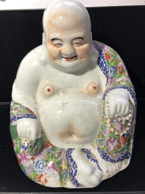 Lot 52 - A large Chinese porcelain figure of a seated...