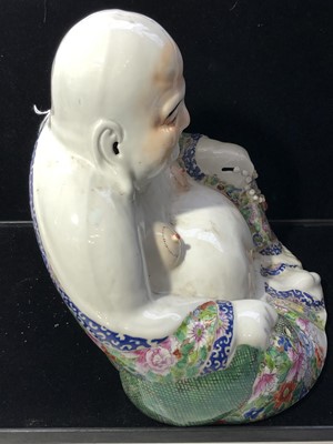 Lot 52 - A large Chinese porcelain figure of a seated...