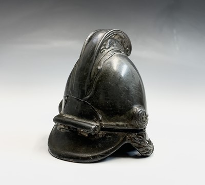 Lot 90 - A pewter inkwell modelled as a fireman's...
