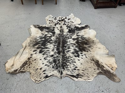 Lot 8 - A cow hide rug, 157.5cm x 154cm.