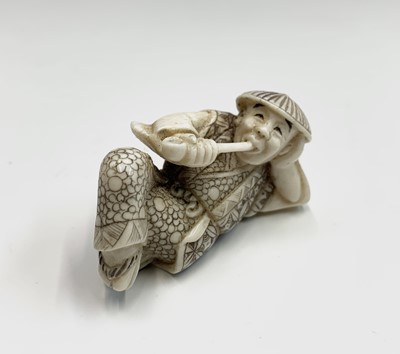 Lot 196 - A Japanese ivory netsuke, early 20th century,...