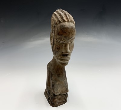 Lot 124 - An African carved wood female bust, height...