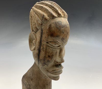 Lot 124 - An African carved wood female bust, height...