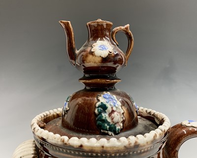 Lot 829 - A Measham treacle glazed bargeware teapot,...