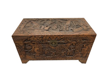 Lot 64 - A Chinese carved camphor wood chest, 20th...