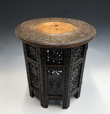 Lot 1015 - An Anglo-Indian carved hardwood folding...