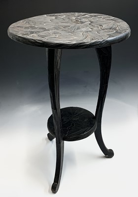 Lot 110 - A Japanese carved stained wood occasional...