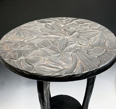 Lot 110 - A Japanese carved stained wood occasional...