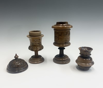Lot 1018 - Two Jerusalem olive wood urns and covers, each...