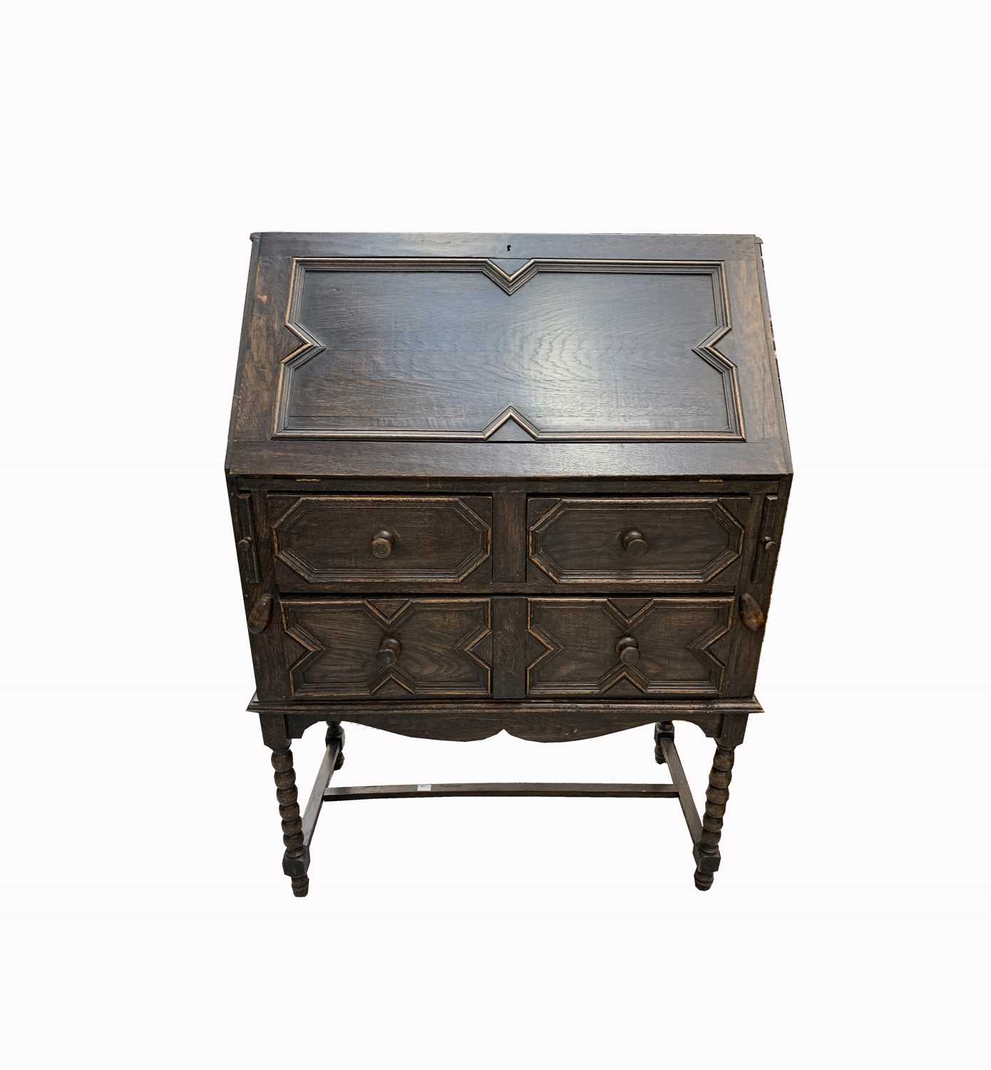 Lot 3071 A Jacobean style oak bureau on stand, early