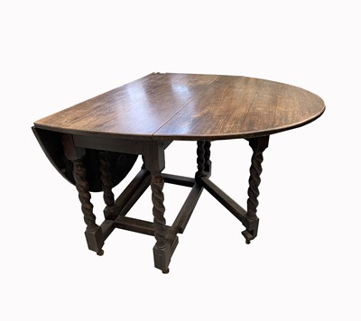 Lot 3070 - An oak barley twist drop leaf dining table,...