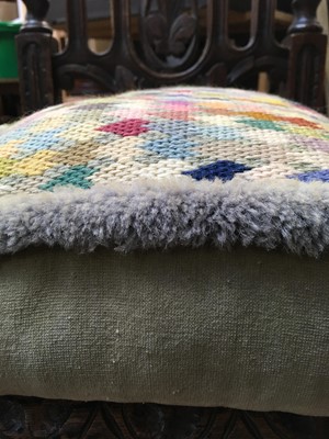 Lot 21 - Vintage cushion with knitted top decoration...