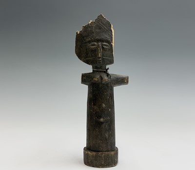 Lot 125 - A carved wood tribal figure with cowrie shell...