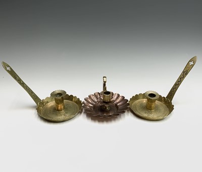 Lot 87 - A pair of brass Arts and Crafts chambersticks,...