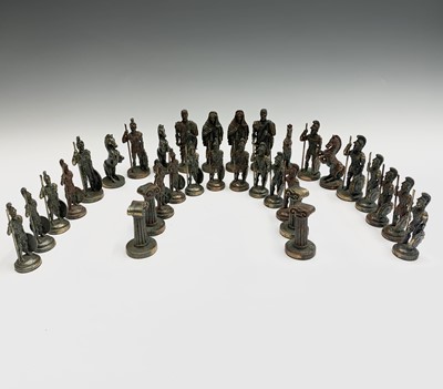 Lot 57 - A cast metal Hellenistic style chess set,...