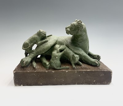 Lot 168 - A 1930s carved stone group of a lion and three...