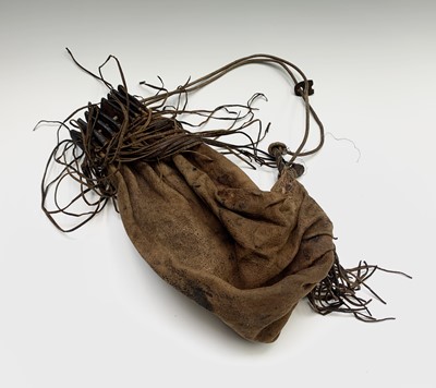 Lot 169 - A tribal animal skin drawstring bag with