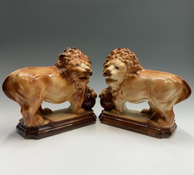 Lot 950 - A pair of Staffordshire lions, circa 1900,...