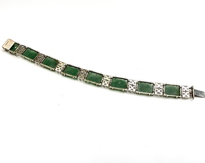 Lot 26 - A Chinese jade and 9ct gold linked bracelet,...