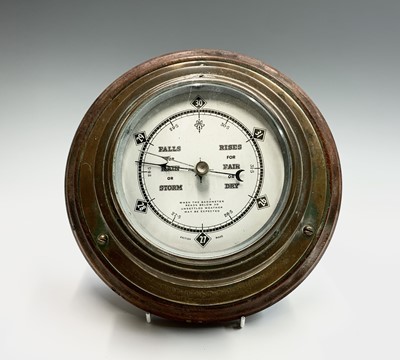 Lot 2903 - A brass cased aneroid barometer, with...