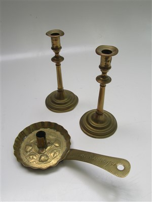 Lot 125 - A pair of 19th century brass candlesticks,...